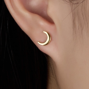 S925 sterling silver gold crescent moon screw stud earring shown on ear model