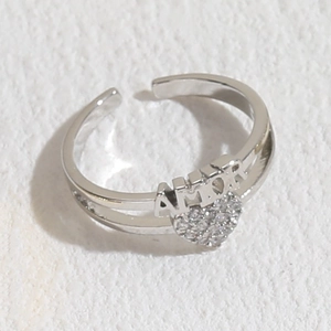 Adjustable silver ring featuring a zircon heart and AMOR lettering in a chic design