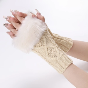 Detail of beige cable-knit fingerless gloves with fluffy white faux fur cuffs for women