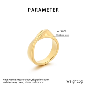Detail shot of 6mm wide irregular wavy stainless steel ring in gold finish