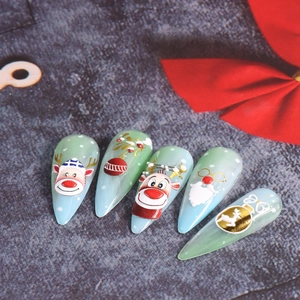 5D embossed Christmas nail art stickers featuring Santa, reindeer and snowflake designs