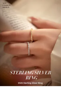 Detailed view of silver and gold S925 sterling silver minimalist eternity rings for women