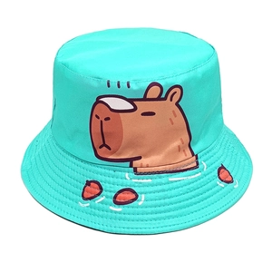 Detail of mint green bucket hat featuring a cute cartoon capybara print in canvas texture