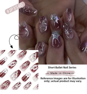 Close-up of short ballet nails with burgundy gradient, silver metal spider web and stars