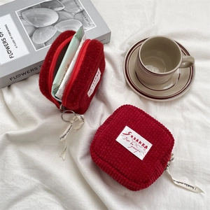 Simple red corduroy plush storage pouch for students with zipper and branded ribbon strap