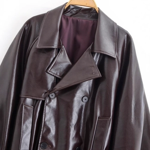 Deep brown faux leather jacket with double-breasted buttons and large lapels