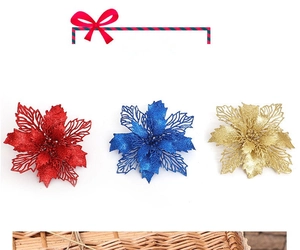 Detailed view of hollowed-out Christmas poinsettia flowers with glittering gold powder finish