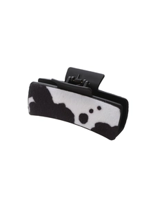 Cow print plush claw clip with black and white faux fur texture for women