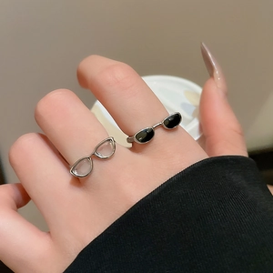 Creative Y2K glasses shaped open rings set in silver and black on hand