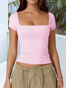Detail of pink square neck short sleeve T-shirt with slim fit on a model outdoors