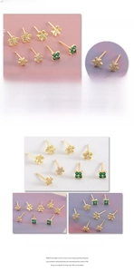 Close-up details of gold flower and star stud earrings with green zircon stones