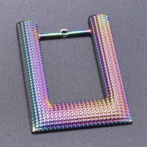 Detailed view of rectangle U-shaped rainbow necklace charm with textured dot surface