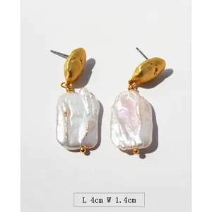 Vintage French baroque pearl drop earrings in gold-plated brass measuring 4cm by 1.4cm
