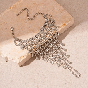 Close-up of silver mesh bracelet with water drop rhinestones and elegant fringe tassels