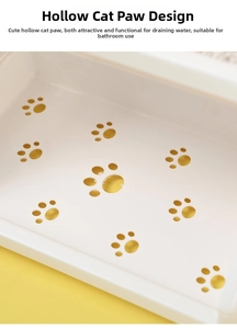 Close-up of white storage rack featuring hollowed-out cat paw design for drainage