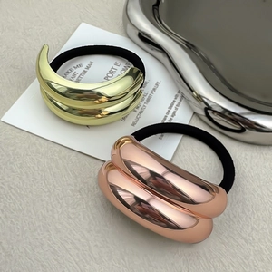 Minimalist alloy hair ties in gold and rose gold with sleek curved metal accents