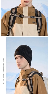 Detail of gray knitted winter beanie with warm fleece lining for outdoor protection