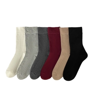 Vertical arrangement of multi-color ribbed crew socks in six classic neutral colors