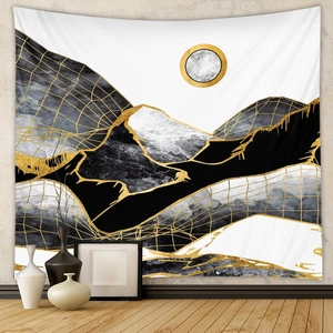 Detail of modern abstract mountain tapestry with gold lines on minimalist grey wall