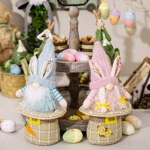 Easter gnome plush doll with rabbit ears and carrots in soft blue and pink colors