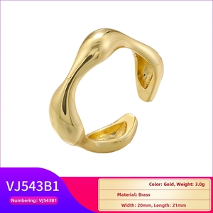 Detailed view of an organic wave-shaped brass ring in gold with 3.0g weight and polished finish