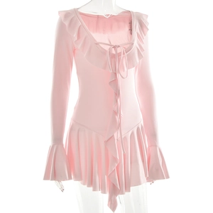 Detailed view of pink long sleeve dress with ruffled edges and drawstring neckline