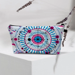 Detail of waterproof evil eye cosmetic bag with zipper closure and geometric patterns