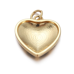 Detailed view of heart pendant with fingerprint texture and gold finish