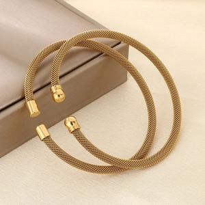 Detail of 18K gold plated mesh cable bracelets with spherical and cylindrical ends