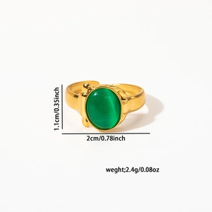 Macro detail of vintage gold adjustable ring featuring a green oval cat eye stone