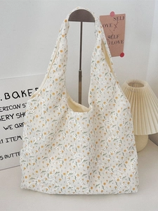 Floral canvas tote bag with yellow embroidery and paisley patterns for daily commute