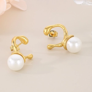 Modern geometric gold irregular stud earrings with large white pearl on beige background