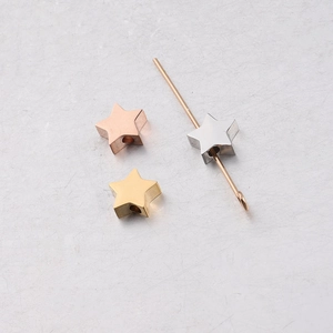Detailed view of 7.7x8mm star beads in gold, rose gold and silver stainless steel