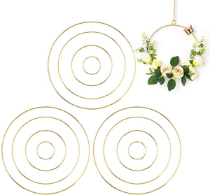 DIY gold metal floral hoops set with finished floral wreath example on white background