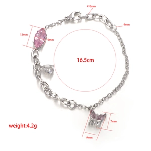 Detailed view of silver chain bracelet with pink marquise stone and butterfly charm