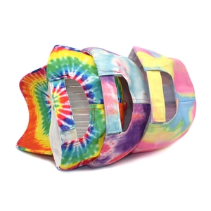 Detail view of the adjustable velcro strap and tie-dye patterns on colorful baseball caps