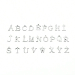 Professional set of 26 silver metal heart-shaped initial A-Z charms on white background