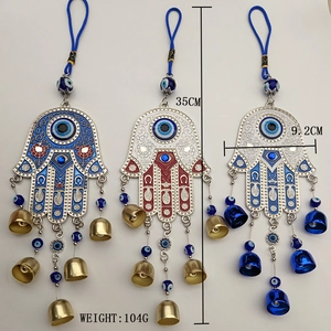 Detailed view of Hamsa Hand and Evil Eye bells with dimensions 35cm by 9.2cm