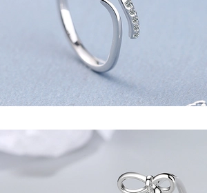Macro shot of silver bow ring featuring sparkling zircon inlay and adjustable band