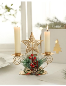 Macro detail of golden Christmas candle holder with red berries and plaid bow