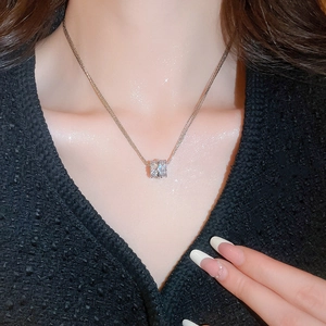 Detail of a sparkling multilayer zircon circle pendant necklace on a female model
