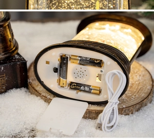 Detailed view of dual power supply options including USB cable and battery compartment