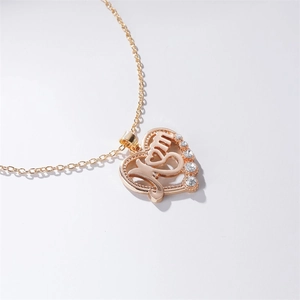 Detail of rose gold heart necklace with Mom letter pendant and inlaid white rhinestones