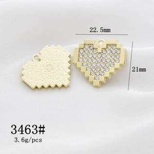 Macro view of gold heart lock pendant with rhinestones for DIY jewelry making