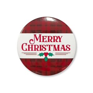 Close-up of a round 58mm tinplate Christmas badge with red and black buffalo check pattern