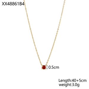 Detail shot of 18K gold plated birthstone necklace with 0.5cm red zircon pendant