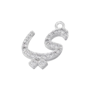 Macro shot of silver Arabic letter Ya pendant with sparkling micro-inlaid zircons