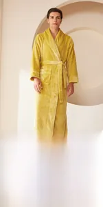 Detailed view of yellow flannel bathrobe with shawl collar and contrasting white piping edges