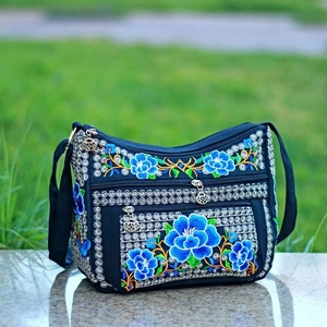 Ethnic navy canvas crossbody bag with floral embroidery and multi-layer zippers