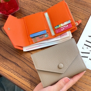 Slim tri-fold leather wallet for women with pebble texture and multiple card slots